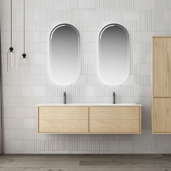 Modern double vanity with ash wood veneer finish and an integrated solid surface basin, paired with dual oval LED mirrors. Complemented by a tall matching storage cabinet, creating a clean and natural aesthetic in a tiled bathroom.
Minimalist single vanity with ash wood veneer and an integrated solid surface basin, paired with an oval LED mirror. The light wood tones contrast beautifully with the white tiled wall for a refreshing, modern look.
Contemporary ash wood veneer vanity featuring push-open drawers,