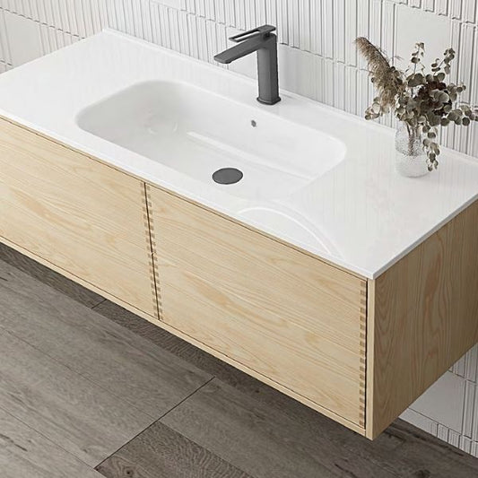 Modern double vanity with ash wood veneer finish and an integrated solid surface basin, paired with dual oval LED mirrors. Complemented by a tall matching storage cabinet, creating a clean and natural aesthetic in a tiled bathroom.
Minimalist single vanity with ash wood veneer and an integrated solid surface basin, paired with an oval LED mirror. The light wood tones contrast beautifully with the white tiled wall for a refreshing, modern look.
Contemporary ash wood veneer vanity featuring push-open drawers.