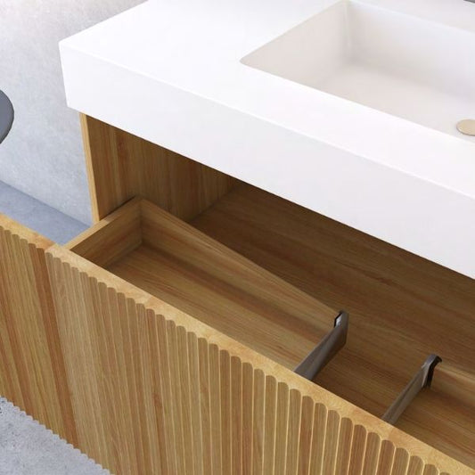 Minimalist wall-mounted vanity with an acacia wood ribbed finish, an integrated artificial stone basin, and a matching tall storage cabinet. Complemented by a rectangular LED mirror, creating a sleek and modern design against a neutral wall.
Contemporary acacia wood vanity featuring a soft-closing drawer, an artificial stone integrated basin, and a rectangular LED mirror. Paired with a tall matching storage cabinet, offering both style and functionality for modern bathrooms.