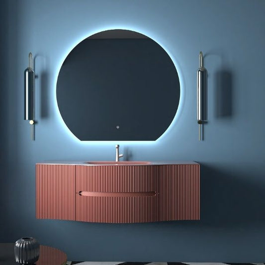 Luxurious Morandi red lacquered vanity with curved ribbed design, featuring an aluminum integrated basin and a soft-closing drawer. Paired with a circular LED mirror and elegant vertical light fixtures on a modern blue wall.
Stylish red vanity with a sleek curved structure, ribbed detailing, and integrated aluminum basin. Complemented by a round LED mirror and contemporary wall lights, set against a bold interior with geometric flooring.