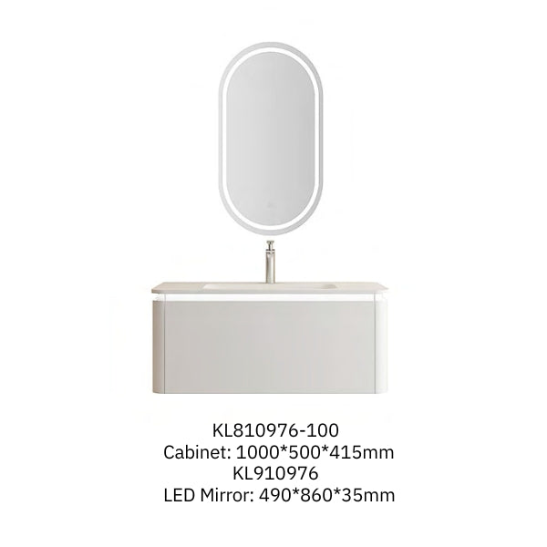 Modern wall-mounted vanity with a minimalist beige PET and melamine finish, featuring a solid surface basin and a sleek oval LED mirror. Accented by a black marble side table and geometric lighting for a contemporary bathroom design.
Elegant beige vanity with a single soft-closing drawer and a solid surface basin, paired with an oval LED mirror. The design emphasizes simplicity and functionality, perfect for a clean and modern bathroom aesthetic.